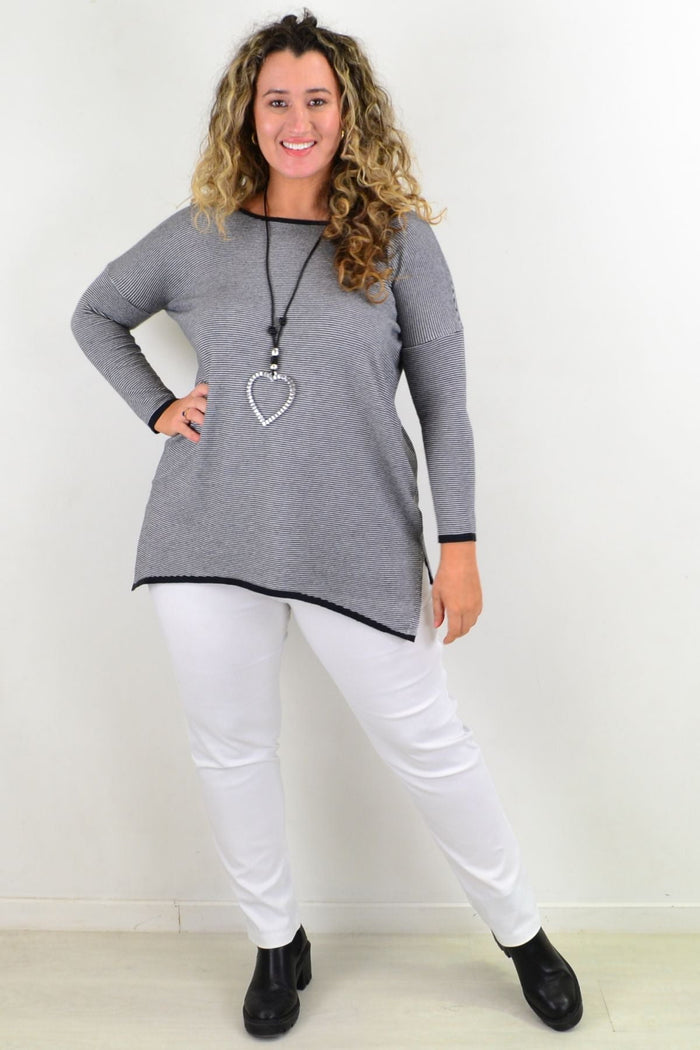 Willow Tree black candy stripe tunic top with long sleeves and relaxed fit, displayed on a hanger against a plain background.