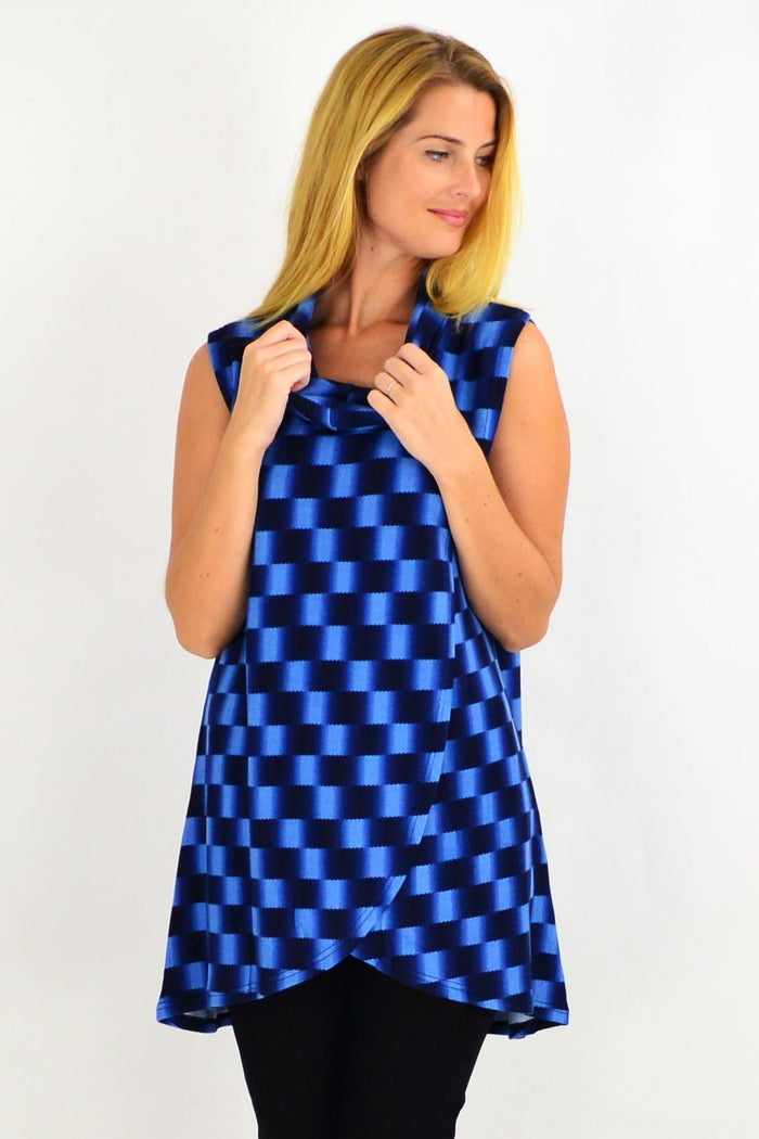 Blue check fold-over front tunic top by Whispers, sleeveless design, casual style, shown with a relaxed fit and front fold detail.