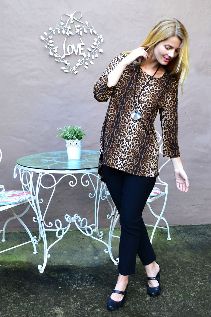 Whispers camel cheetah print tunic top with hi-low hem, featuring a stylish animal print design and relaxed fit.
