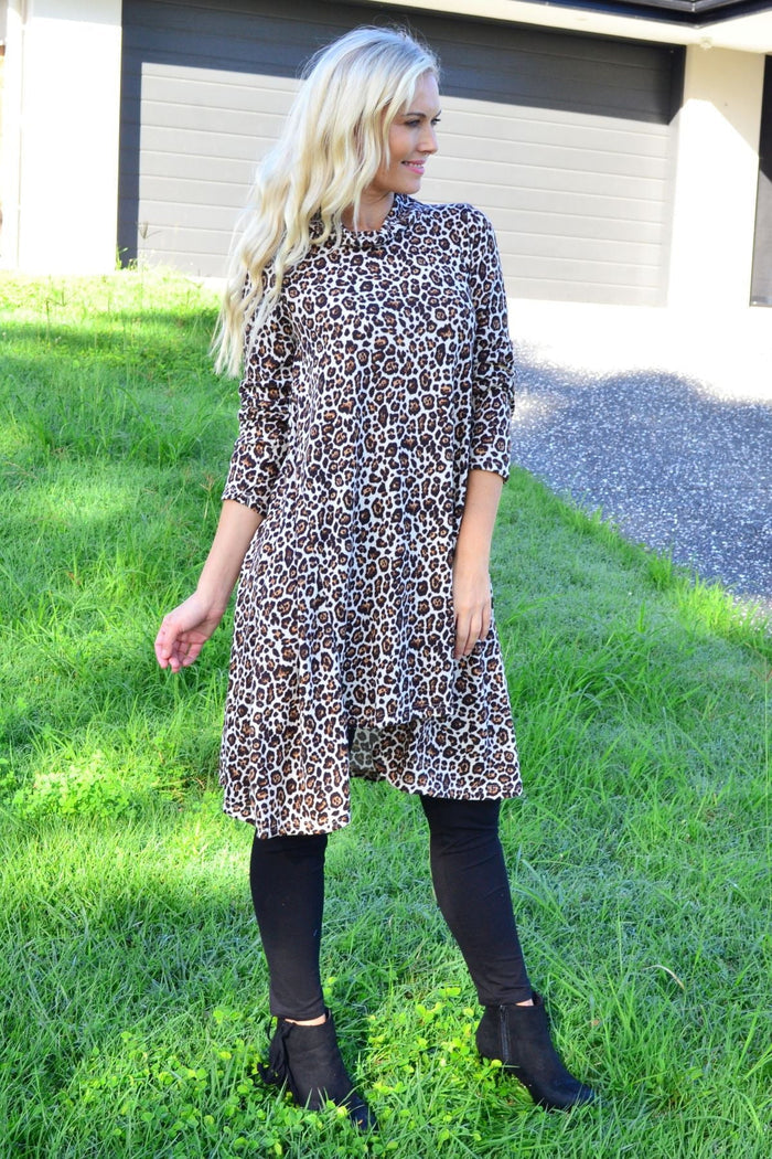 Leopard print high neck fleece tunic dress by Hourglass, showcasing a cozy, stylish design with a high neckline and animal print fabric.