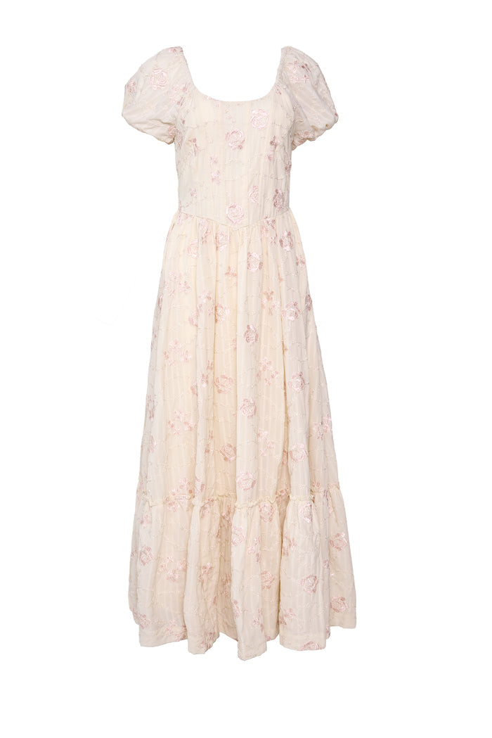 The Tara Dress in Gilded Rose Stripe by Ivy City Co is a cream maxi with short puff sleeves, scoop neckline, pink floral embroidery, and a tiered skirt.