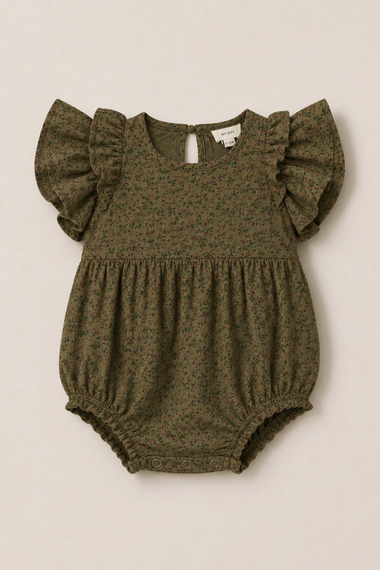 The Baby Hattie Romper in Woodland Floral by Ivy City Co features a charming olive green hue with a delicate floral print, flutter sleeves, a gathered waist, and practical snap closures at the bottom. Crafted from soft cotton, this romper is perfect for providing everyday comfort and style.