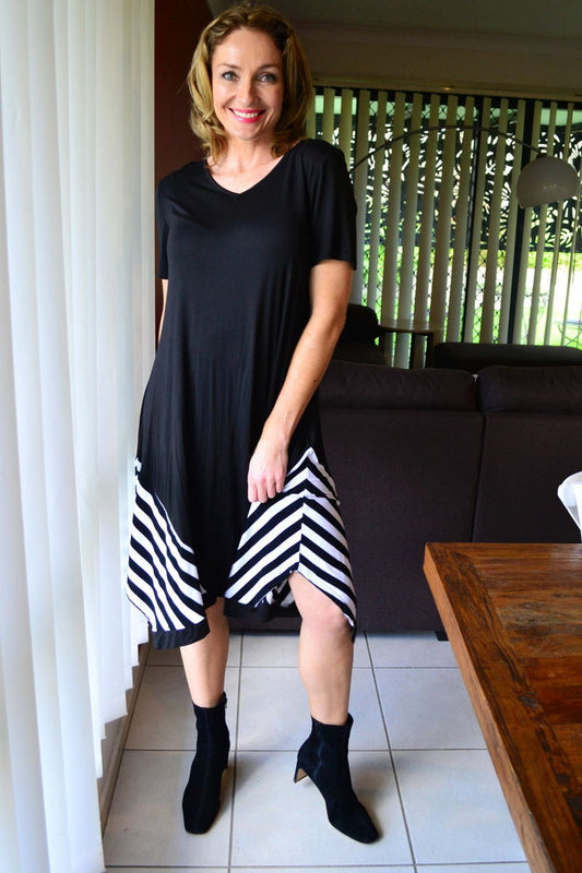 Black and white short sleeve bamboo tunic dress by Cordelia St, shown on a model with a relaxed fit and casual style.