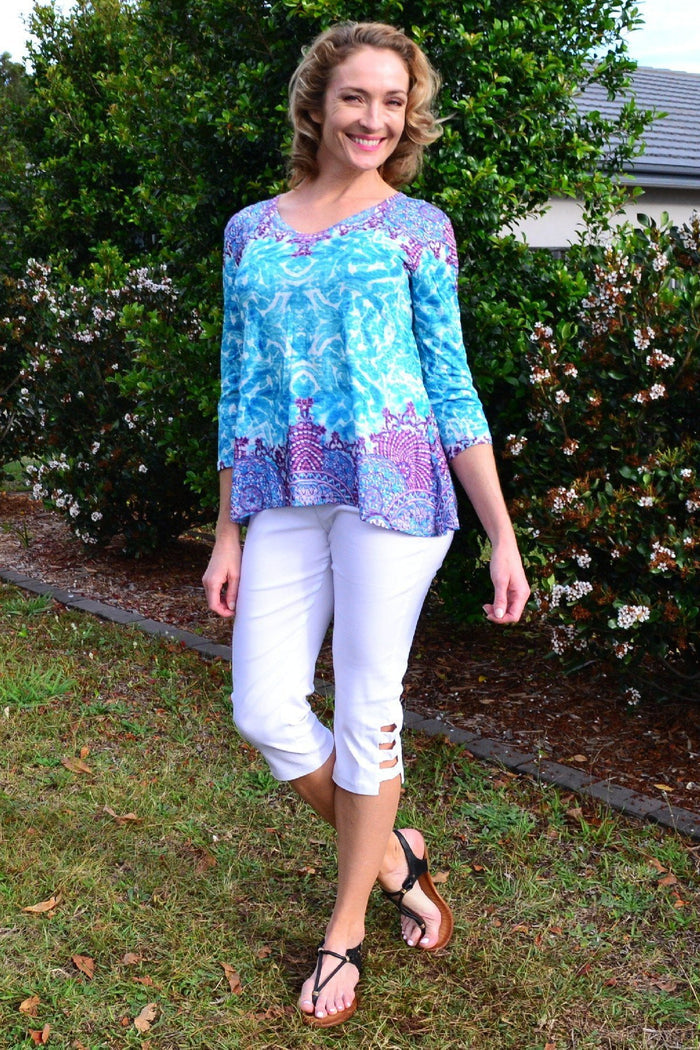 Blue Royal Tunic Tee from Zen Garden, casual women’s tunic with a relaxed fit and vibrant blue color, displayed on a hanger.