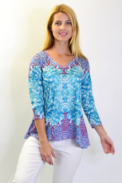 Blue Royal Tunic Tee by Zen Garden, casual women's tunic with a relaxed fit and round neckline, displayed on a hanger.