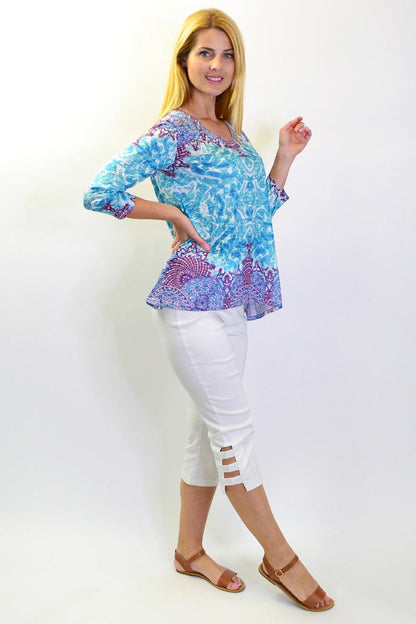 Blue Royal Tunic Tee from Zen Garden, featuring a relaxed fit and soft fabric, shown on a hanger with a plain background.