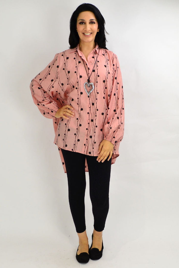 Blush pink loose tunic shirt by Cotton Village, featuring festive light fabric and a comfortable, stylish fit.