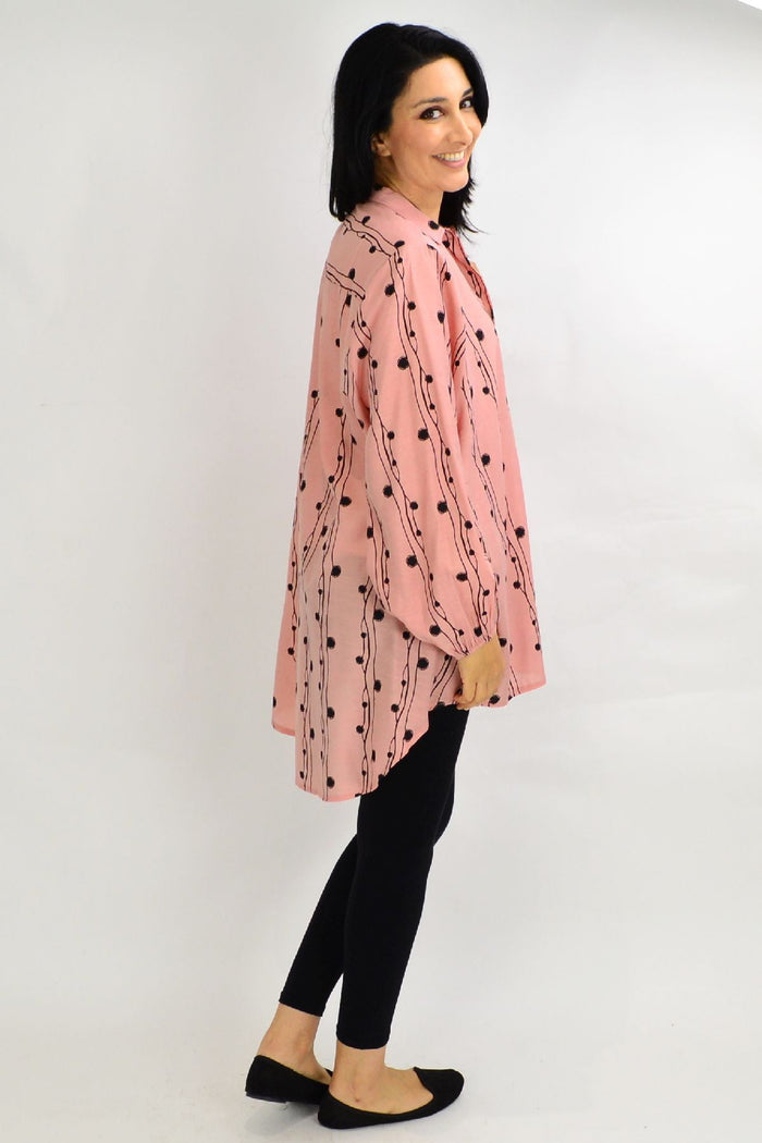 Blush pink loose-fit tunic shirt by Cotton Village, perfect for festive occasions, featuring a comfortable and stylish design.