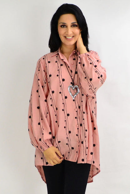 Blush pink loose-fit tunic shirt from Cotton Village, featuring festive design and comfortable fabric, ideal for casual wear.
