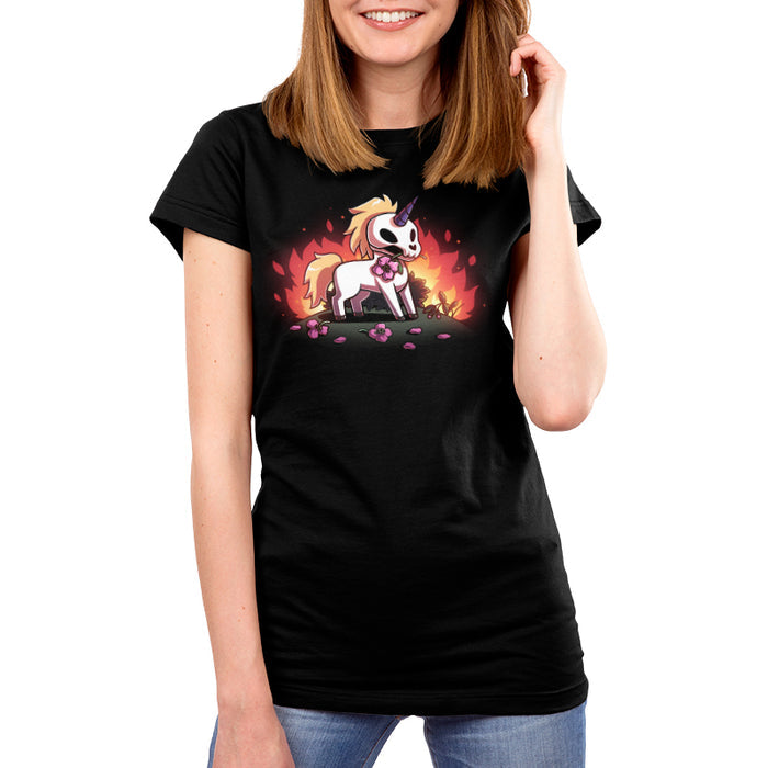 Premium Cotton T-shirt_TeeTurtle black Chaotic Good apparel featuring a skull unicorn holding a pink flower in its mouth with dead flowers at its feet and fire in the background.