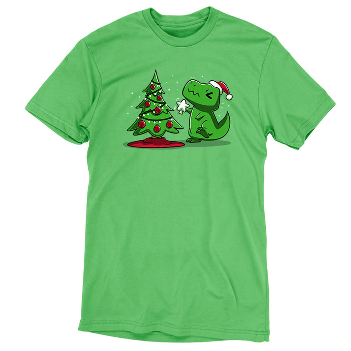Premium Cotton T-shirt_TeeTurtle Christmas T-Rex apple t-shirt featuring a cartoon dinosaur wearing a Santa hat placing a star atop a Christmas tree adorned with red baubles and lights.