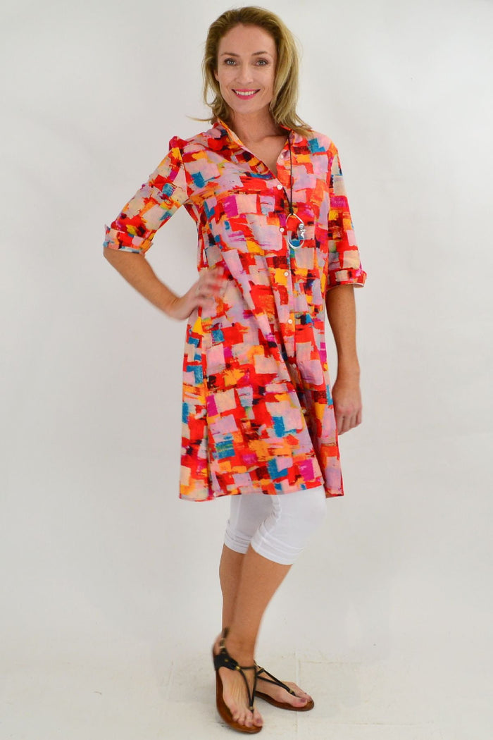 Color block Ruby Rain tunic dress with long sleeves and a relaxed fit, shown hanging on a white background.