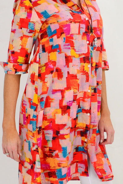 Color block Ruby Rain tunic dress with long sleeves and relaxed fit, displayed on a hanger against a neutral background.