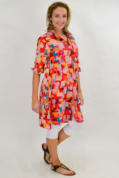 Color block Ruby Rain tunic dress with long sleeves and a relaxed fit, displayed on a hanger against a neutral background.