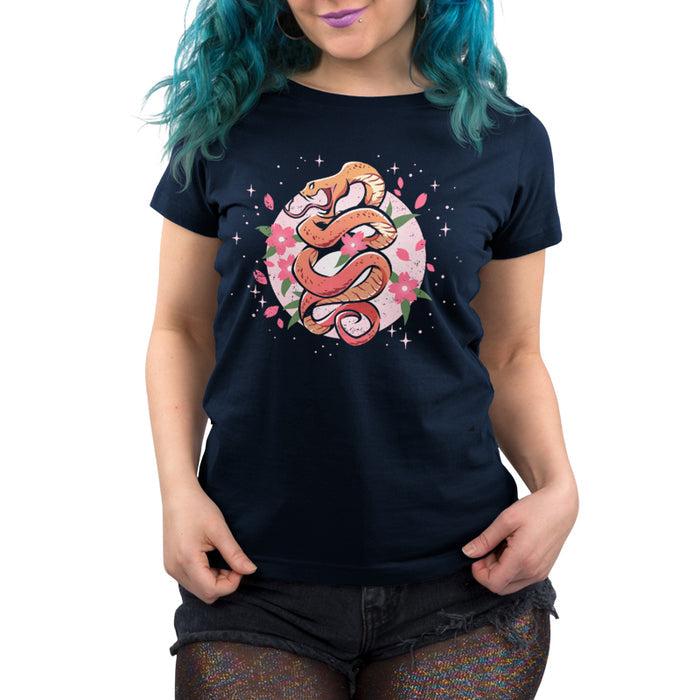 Premium Cotton T-shirt_TeeTurtle navy blue Enchanting Snake apparel featuring an orange snake coiling upwards with pink flowers and petals surrounding it.