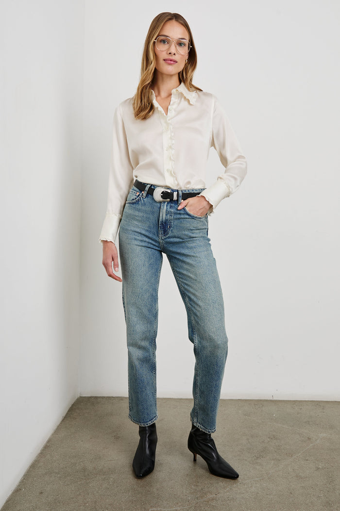 Fia Long-Sleeve Button Up with Lettuce Edges on the Collar, Cuffs, and Closure in Ivory Colorway - Front Tucked Full Body View Featured on Model