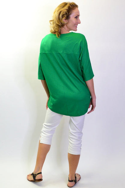 Grass green Stylius sloping sleeve tunic top displayed on a mannequin, showcasing its stylish design and vibrant color.