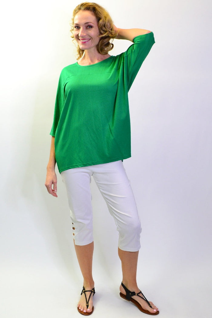 Grass green Stylius sloping sleeve tunic top made of jersey fabric, featuring a stylish, relaxed fit and sloped sleeve design.