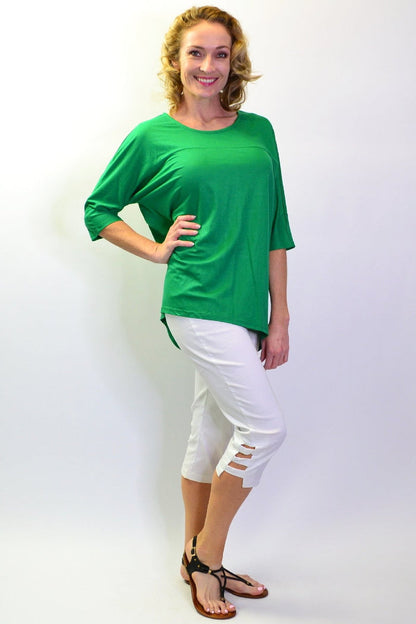 Grass green Stylius sloping sleeve tunic top made of soft jersey fabric, featuring a relaxed fit and stylish design.