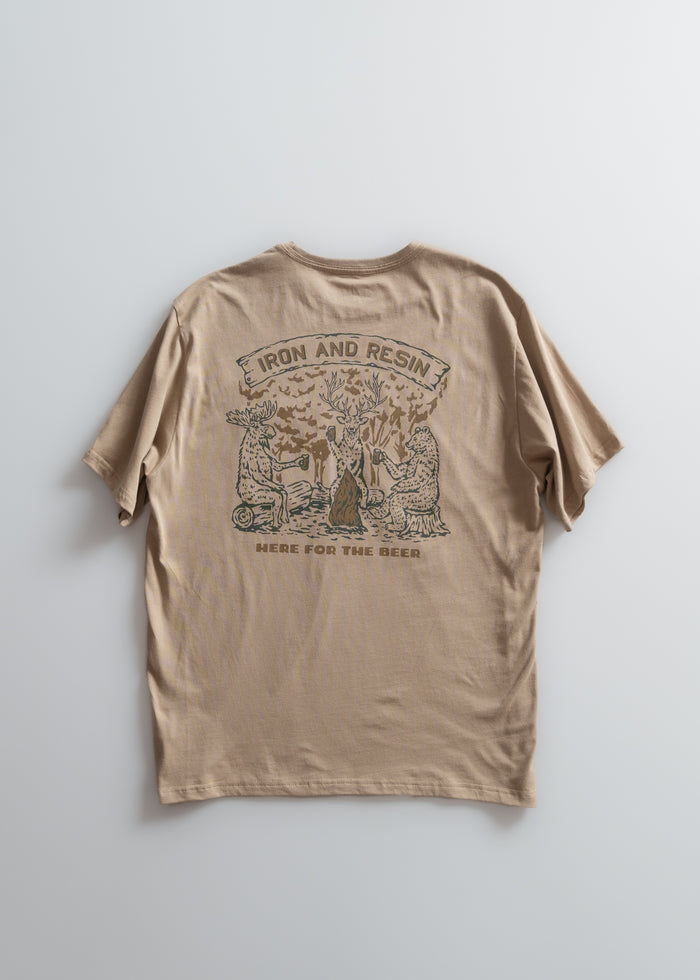 Tan t-shirt with "Iron and Resin" and "Here for the Beer" text, featuring animals around a tree.