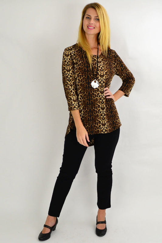Whispers camel cheetah print hi-low hem tunic top with long sleeves and relaxed fit, styled on a model.