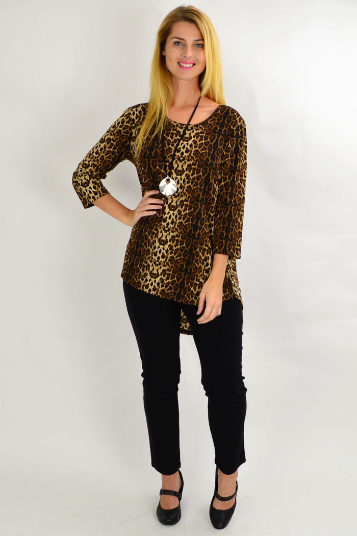 Whispers camel cheetah hi-low hem tunic top displayed on a hanger with a flowing silhouette and bold animal print fabric.