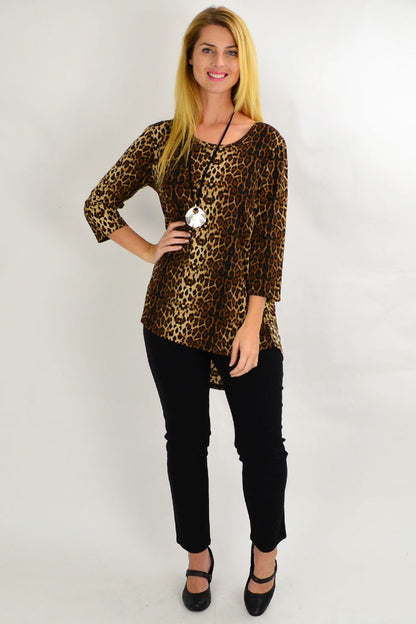 Whispers camel cheetah hi-low hem tunic top displayed on a hanger with a flowing silhouette and bold animal print fabric.