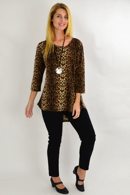 Whispers camel cheetah hi-low hem tunic top displayed on a hanger with a flowy, stylish design and animal print pattern.