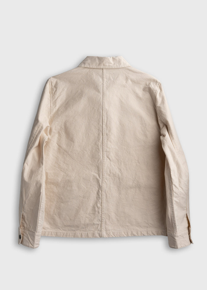 Beige jacket back view on white background, showing collar, long sleeves, and buttoned cuffs. Simple, casual style.