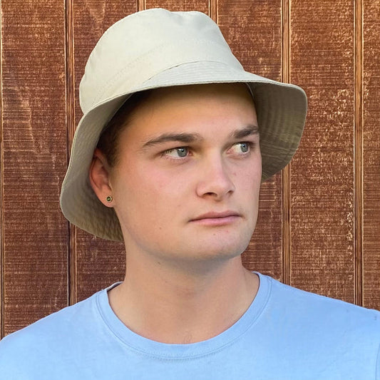 Man wearing light sand coloured Hydroex rain hat.