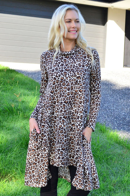 Leopard print high neck fleece tunic dress by Hourglass, featuring a cozy fleece fabric and stylish high neckline.
