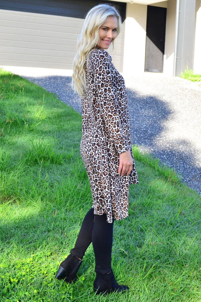 Hourglass leopard print high neck fleece tunic dress displayed on a mannequin, showcasing a stylish, cozy winter outfit.