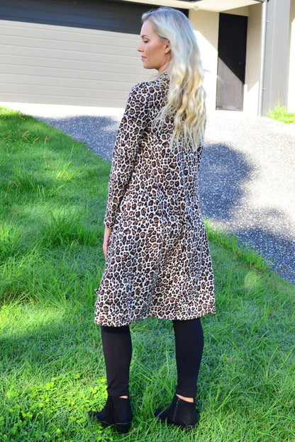Leopard print high neck fleece tunic dress by Hourglass, showcasing the soft fleece fabric and stylish high neckline.