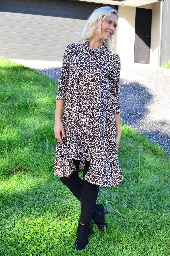 Leopard print high neck fleece tunic dress by Hourglass, featuring a cozy fleece fabric and stylish high neckline.