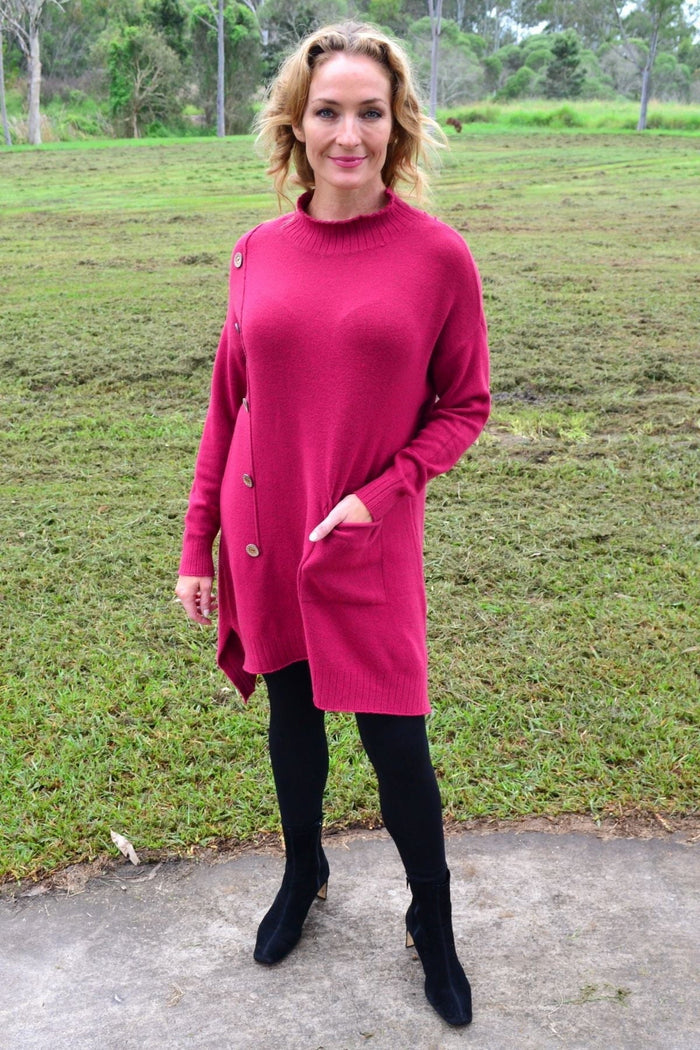 Magenta high neck cozy knit tunic jumper by Wishstone, featuring a warm, textured fabric and a stylish high neckline.