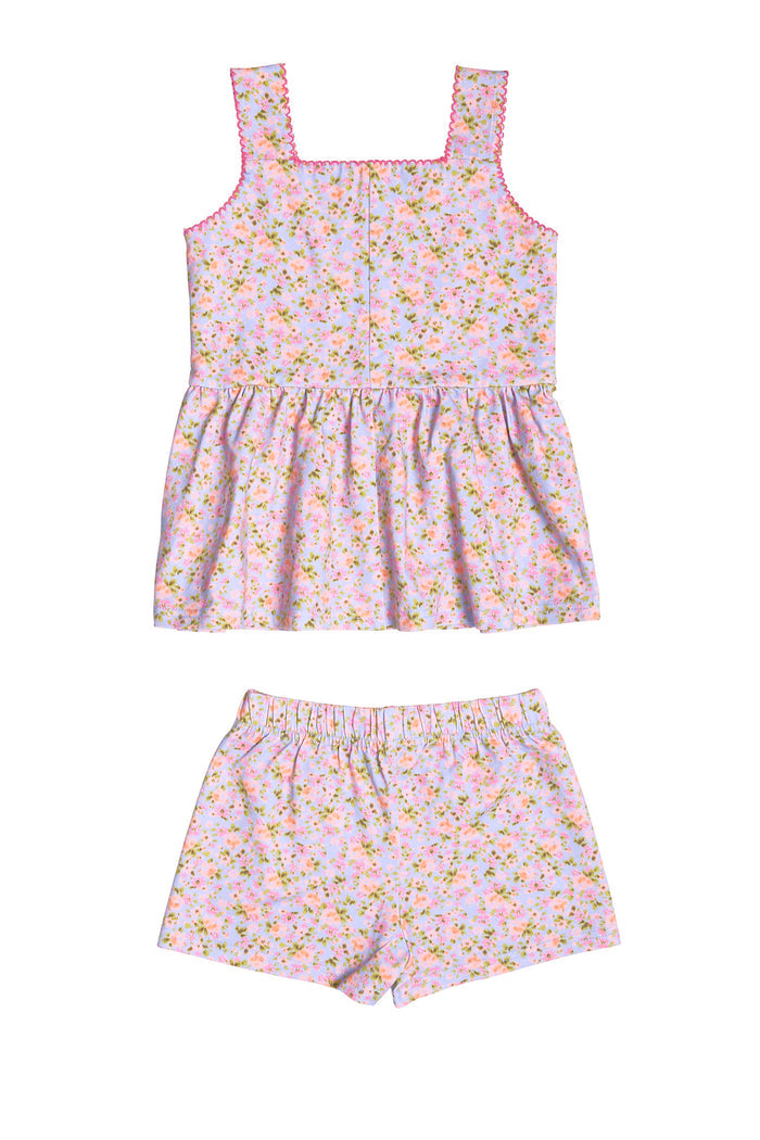 The Mini Blair Play Set in Vibrant English Garden by Ivy City Co is a matching children’s set featuring a sleeveless square-neck top with a gathered fit and comfy elastic-waist shorts, crafted in light pink floral stretch fabric.