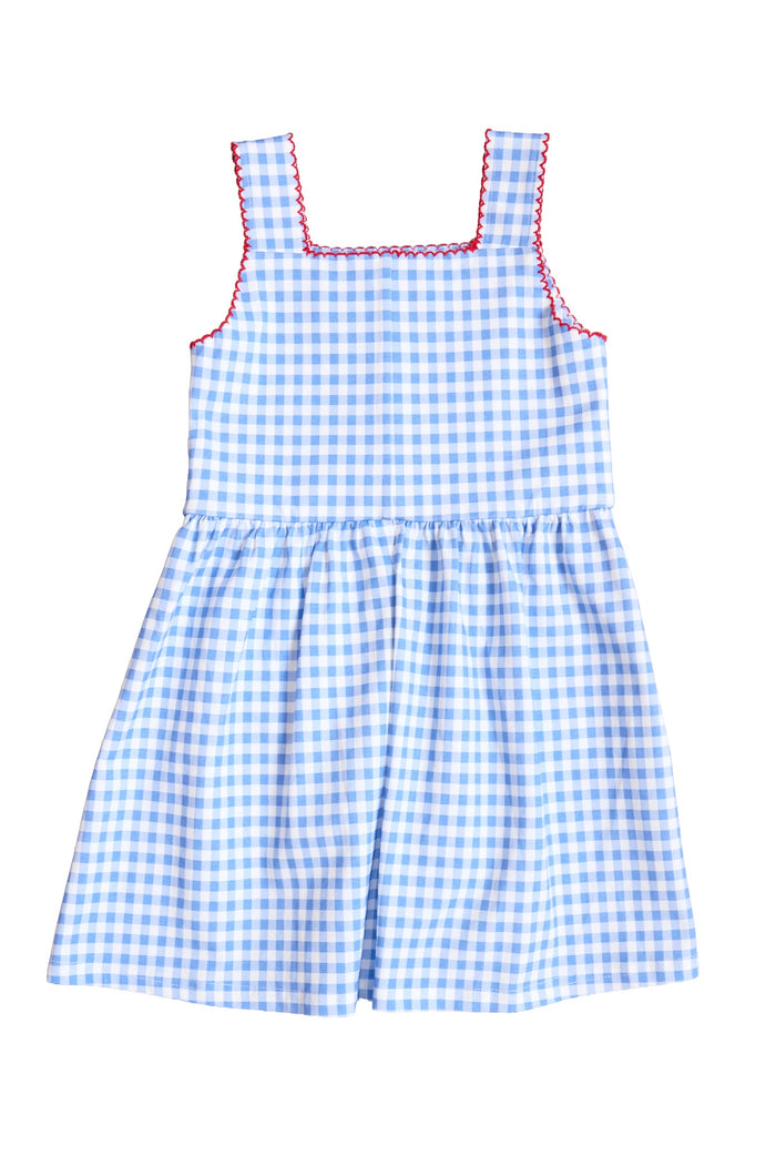 The Mini Rue Play Dress in Vichy Gingham by Ivy City Co is a girls’ sleeveless blue and white gingham dress with a fitted bodice, gathered skirt, square neckline, and red stitching on the neckline and armholes.