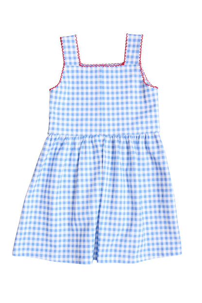 The Mini Rue Play Dress in Vichy Gingham by Ivy City Co is a girls’ sleeveless blue and white gingham dress with a fitted bodice, gathered skirt, square neckline, and red stitching on the neckline and armholes.