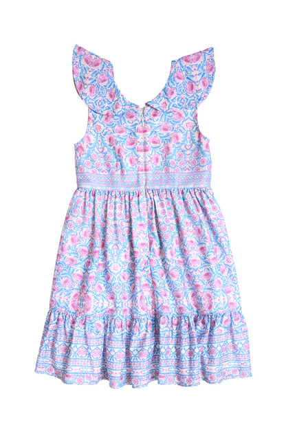 The Mini Samara Dress in Thistle Flower Mosaic Florise by Ivy City Co is a sleeveless girls’ dress with ruffled shoulders and hem, blue and pink floral print, fitted bodice, and gathered skirt—ideal for Mom and Me matching. Displayed flat on white background.
