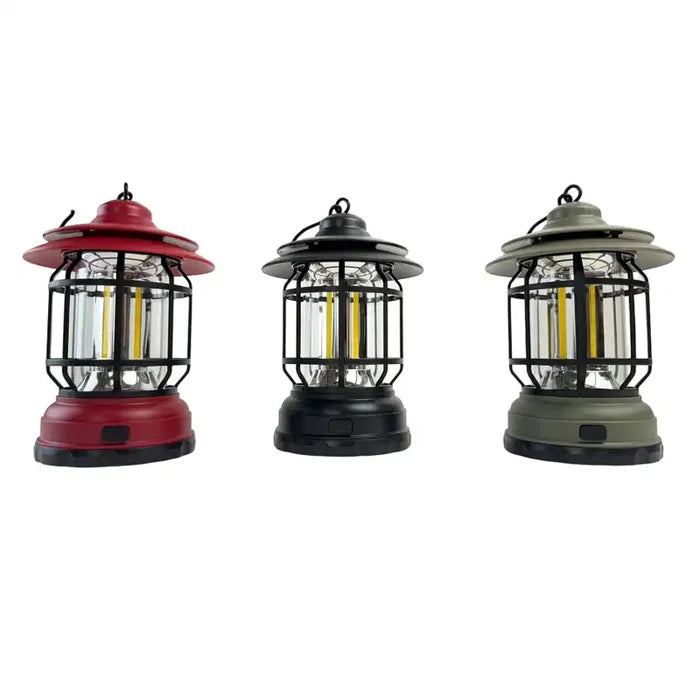 Three hanging lanterns in red, black, and green