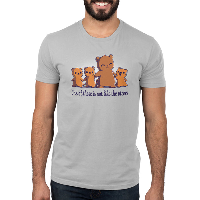 Premium Cotton T-shirt_TeeTurtle One of These is Not Like the Otters silver gray t-shirt featuring three small brown otters and one larger brown bear smiling and standing side by side holding hands with two otters, with the caption "One of these is not like the otters" in cute kawaii script.