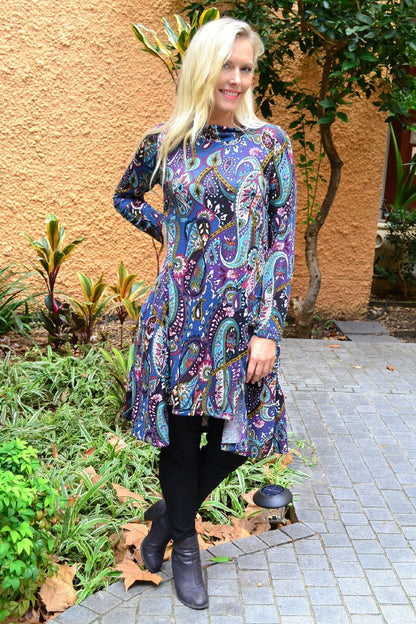 Hourglass Penelope Paisley Fleece Tunic Dress displayed on a hanger, featuring a paisley pattern and cozy fleece fabric.