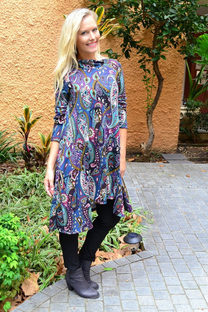 Hourglass Penelope Paisley Fleece Tunic Dress with long sleeves and relaxed fit, displayed on a hanger.