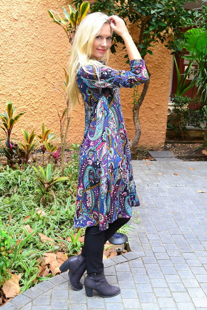 Hourglass Penelope Paisley fleece tunic dress displayed on a hanger with a flowing paisley pattern and cozy fleece fabric.