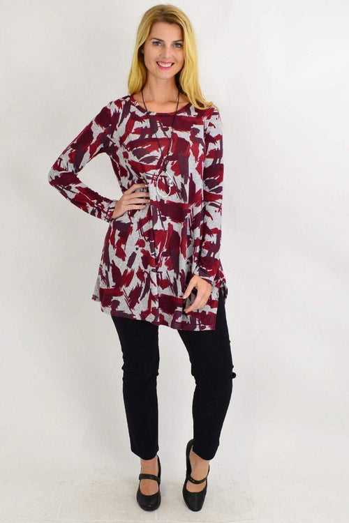 Red paint splash fleece tunic top by Hourglass, featuring a bold red and grey artistic design and relaxed fit.