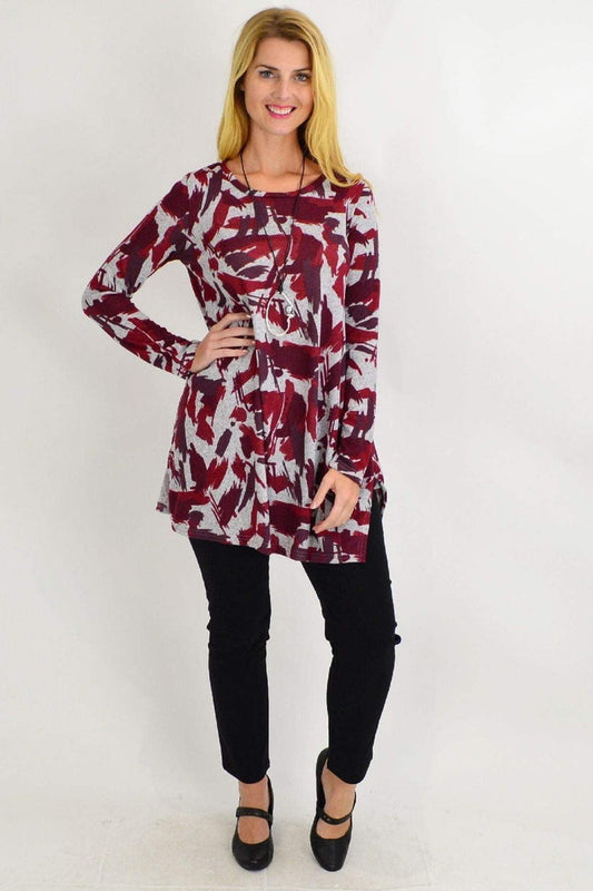 Red paint splash fleece tunic top by Hourglass, featuring a bold red and grey artistic design and relaxed fit.