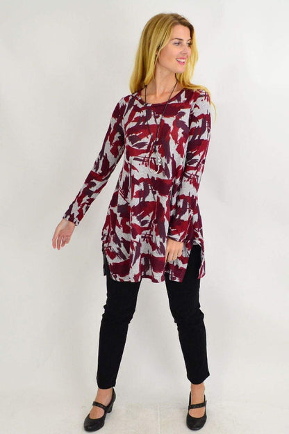 Red fleece tunic top with grey paint splash design, featuring a relaxed fit and casual style by Hourglass.