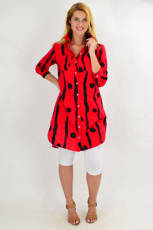 Red tunic shirt with black dots by Ruby Rain, featuring a relaxed fit and long sleeves, displayed on a mannequin.