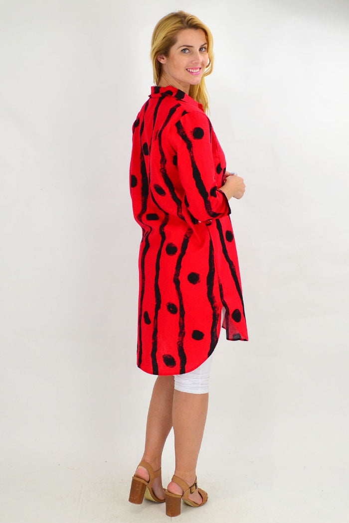 Red Ruby Rain tunic shirt with black dot pattern, long sleeves, and relaxed fit, perfect for casual or stylish wear.