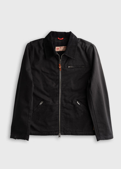 Black jacket with a front zipper, two side pockets, and a chest pocket, laid flat on a white background.